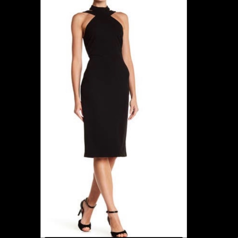 Bebe cocktail dress, black knee length, never worn.